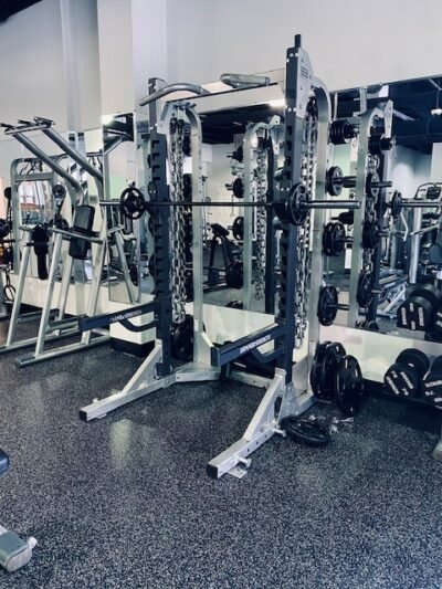 Free weight area includes squat racks, dumbbells to 100 pounds, smith machine, chest supported T-Bar Row, 